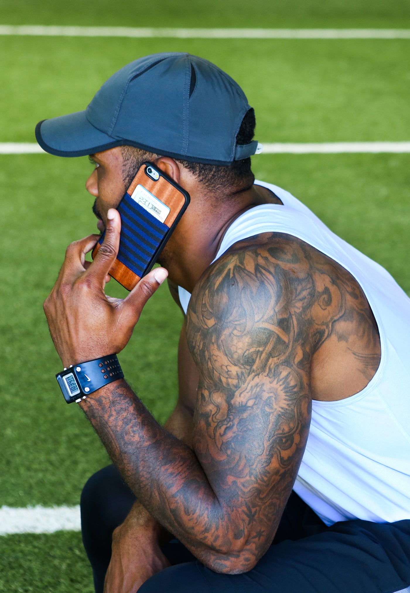Man working out on artificial grass with jimmycase